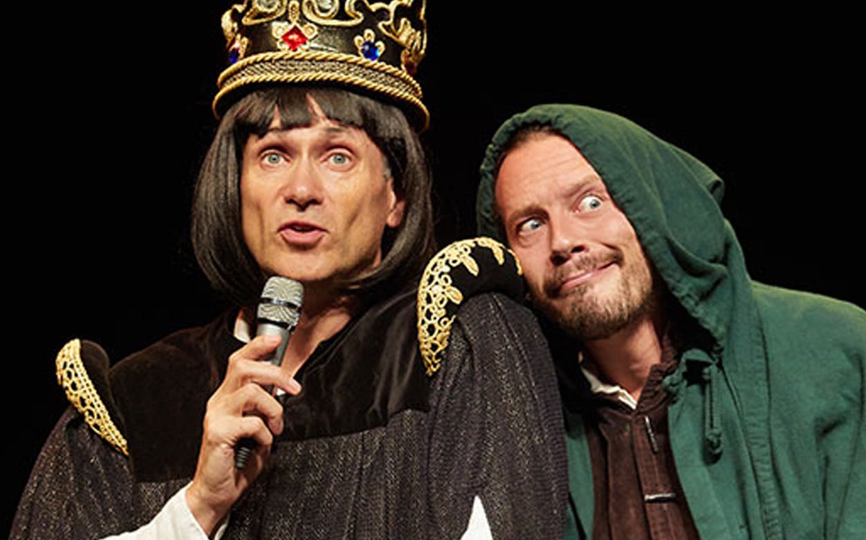 Performer in royal costume with crown and microphone, Horrible Histories: Barmy Britain - Part Four!