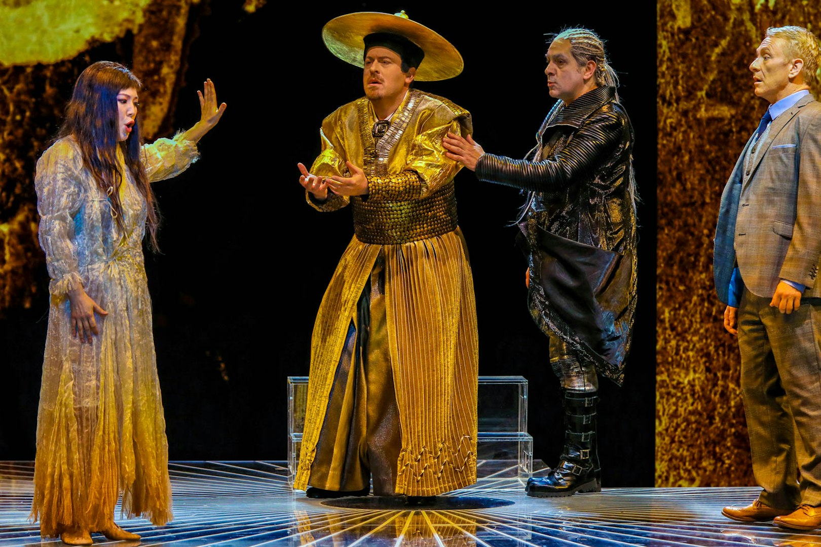 Performers in traditional costumes on stage during Madama Butterfly opera.