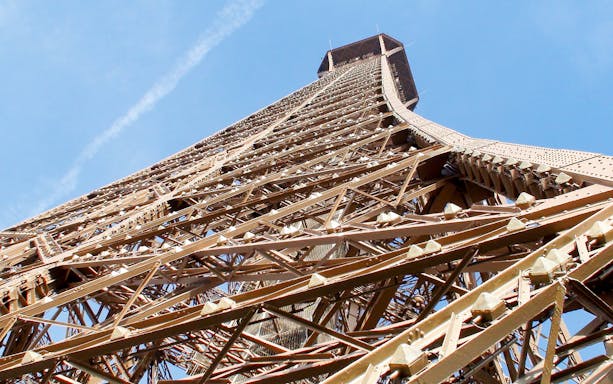 Eiffel Tower structure from below, Paris, part of elevator tour experience.