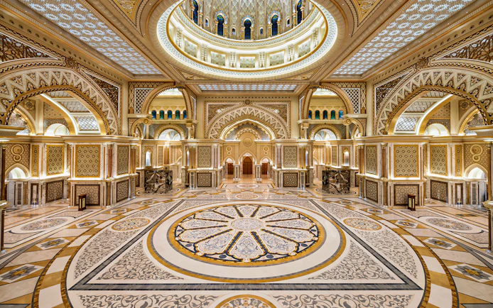 Ornate interior of Qasr Al Watan in Abu Dhabi, showcasing intricate patterns and grand architecture.