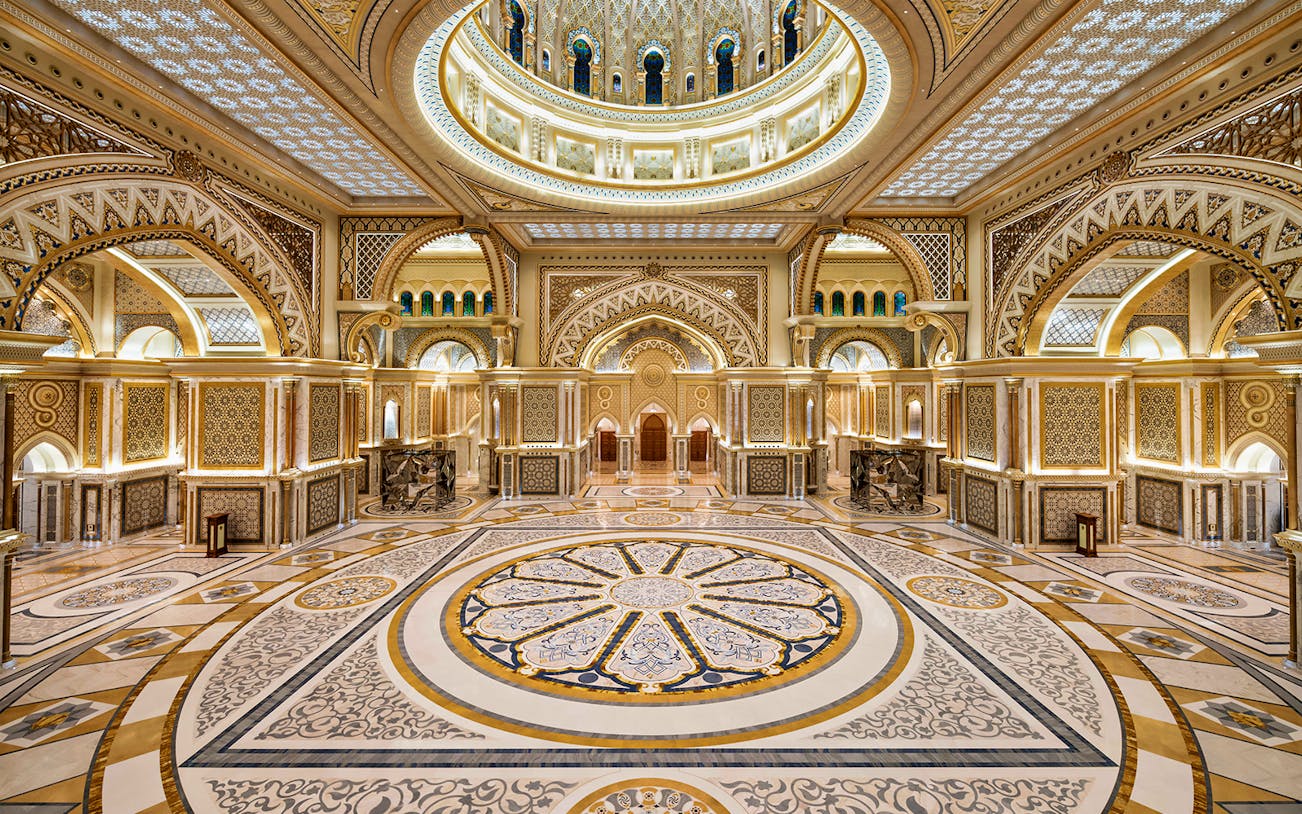 Ornate interior of Qasr Al Watan in Abu Dhabi, showcasing intricate patterns and grand architecture.
