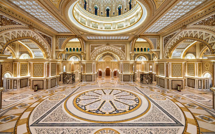 Ornate interior of Qasr Al Watan in Abu Dhabi, showcasing intricate patterns and grand architecture.