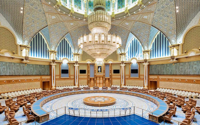 Interior of Qasr Al Watan's grand hall with ornate ceiling and chandelier, Abu Dhabi.