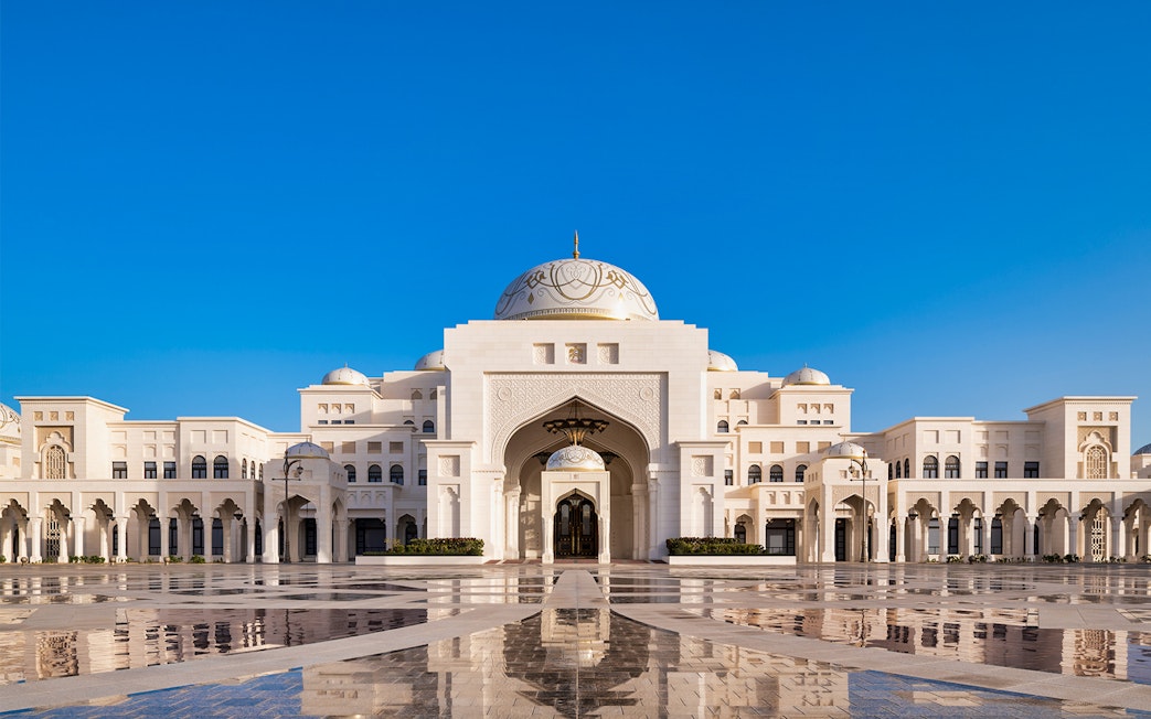 Qasr Al Watan palace exterior with blue sky in Abu Dhabi.