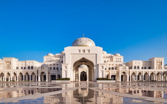 Qasr Al Watan palace exterior with blue sky in Abu Dhabi.