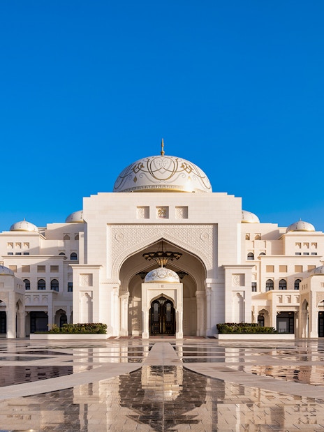 Qasr Al Watan palace exterior with blue sky in Abu Dhabi.