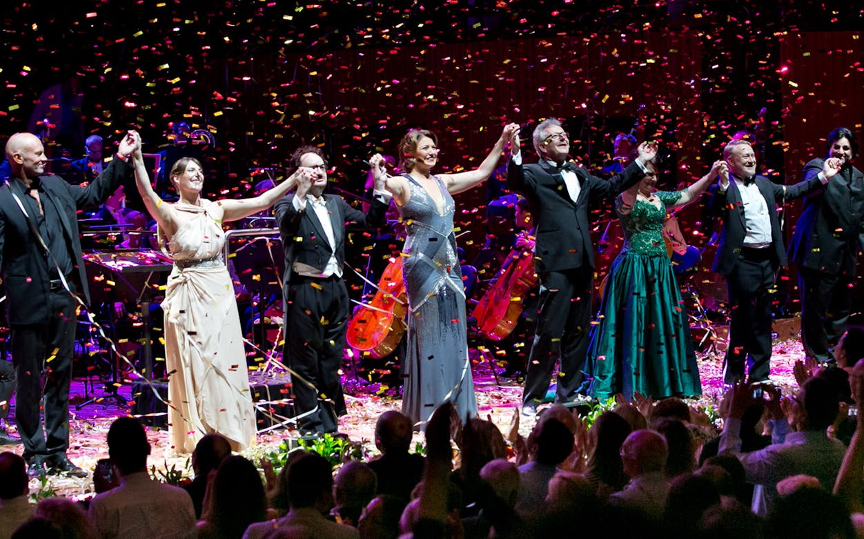 Performers taking a bow at The Opera Gala on New Year's Eve, confetti falling on stage.
