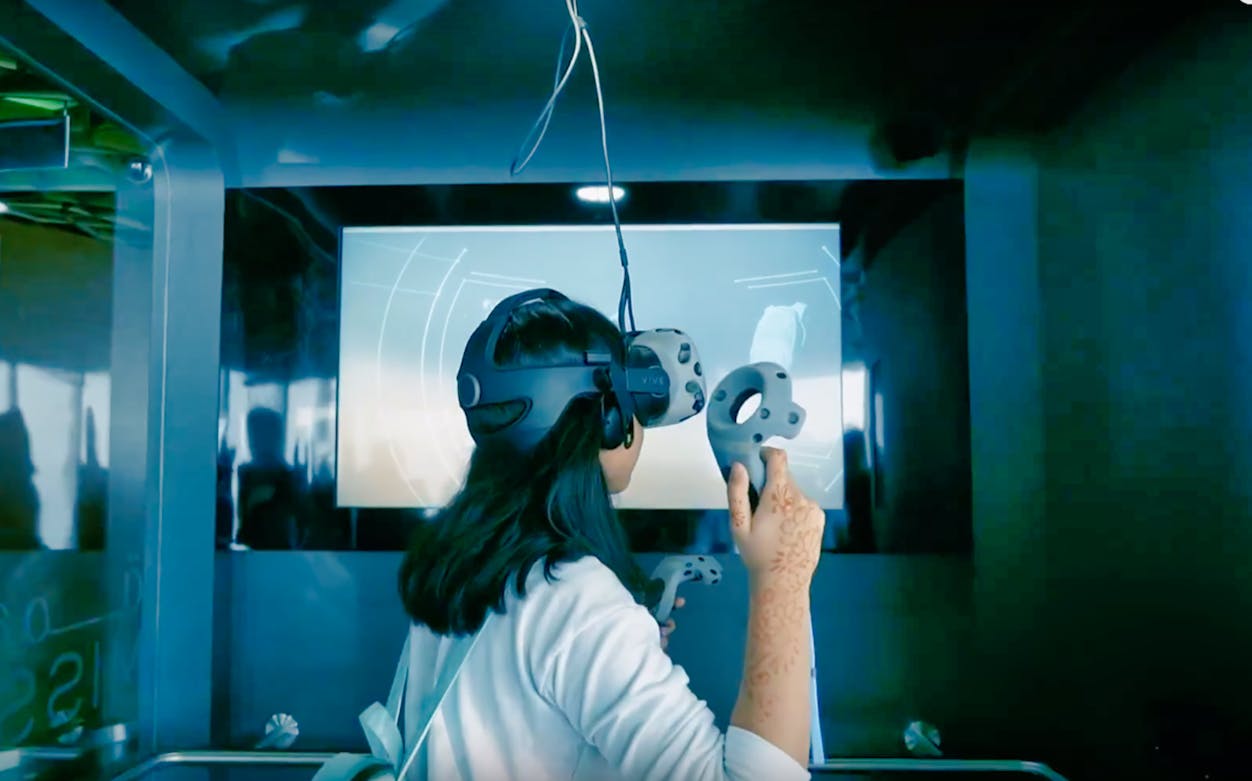 Person experiencing Mission 828 VR at Burj Khalifa, Dubai.