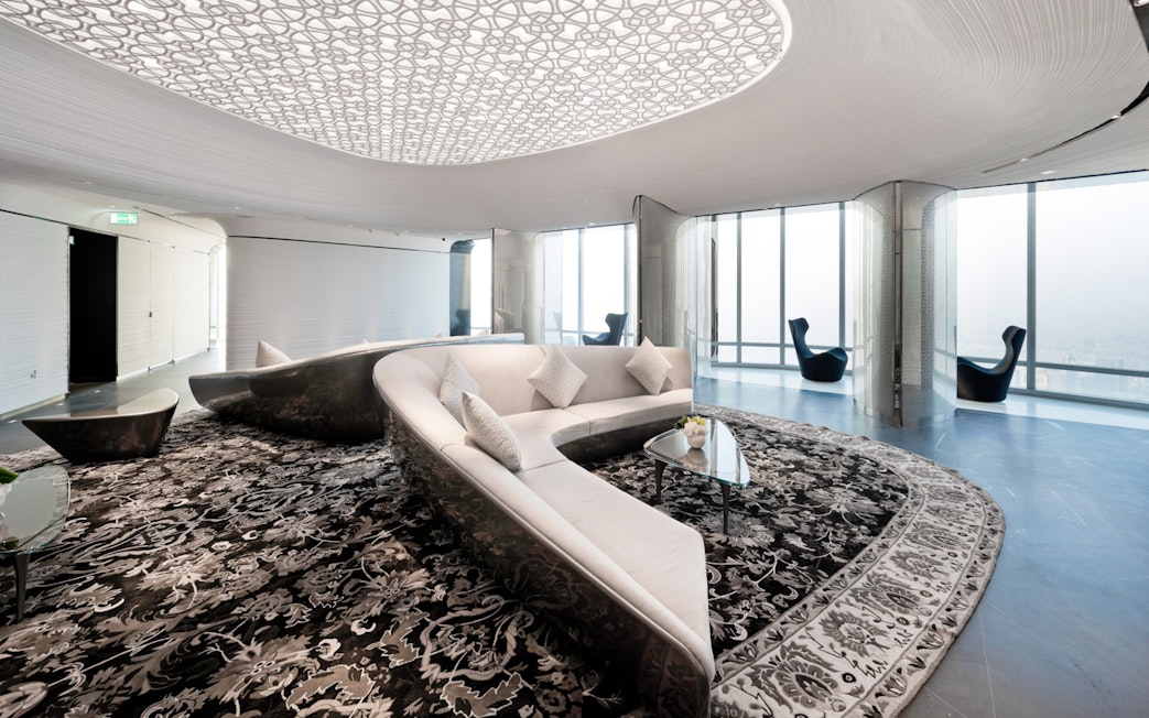 Lounge area with modern seating and patterned ceiling at Burj Khalifa, Dubai.