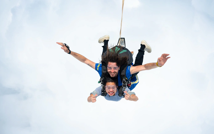 Tandem skydive over Great Ocean Road with instructor and participant freefalling.