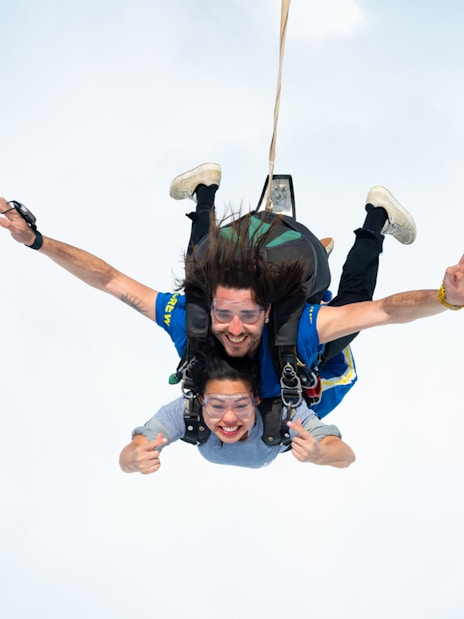 Tandem skydive over Great Ocean Road with instructor and participant freefalling.