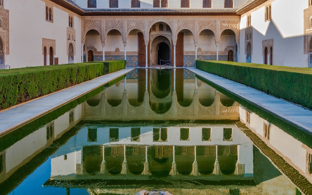 Reflection of Alhambra's Patio de los Arrayanes in Granada, Spain.