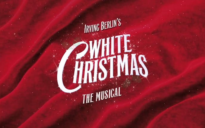 Irving Berlin's White Christmas musical title on red background.