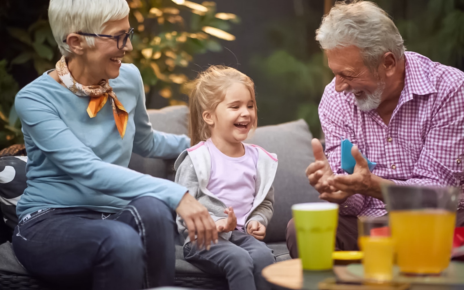 I don't know who these people are, but here's the alt text:

"Family enjoying drinks on Captain Cook Cocktail Harbour Bar Cruise.