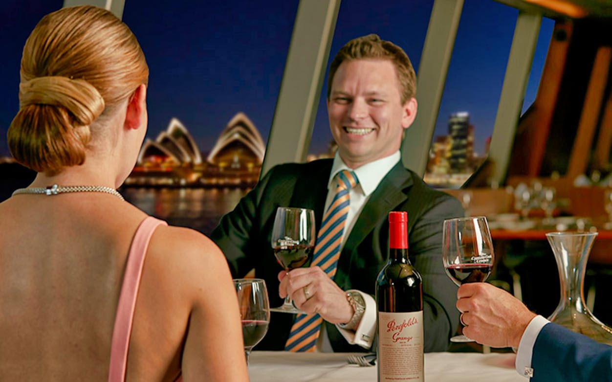 Luxury cruise dinner with Penfolds Grange wine, Sydney Opera House view.