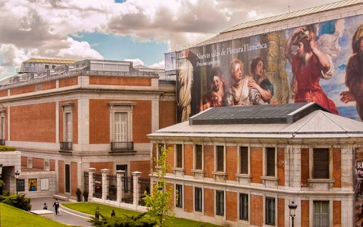 Prado Museum exterior with Flemish painting banner, Madrid.