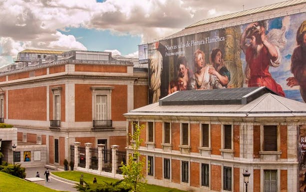 Prado Museum exterior with Flemish painting banner, Madrid.