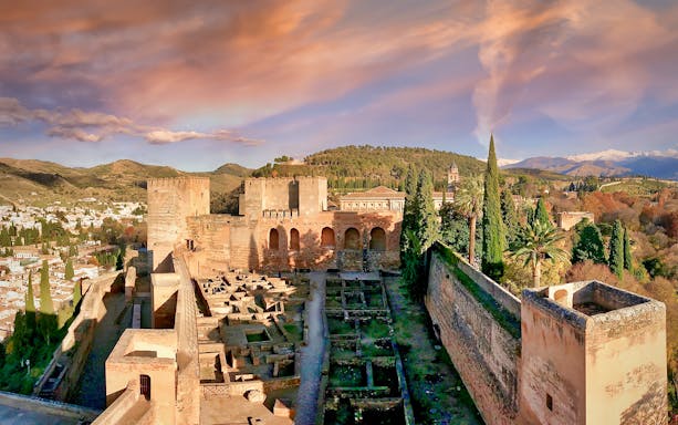 Alhambra's Alcazaba fortress with scenic views of Granada, Spain.