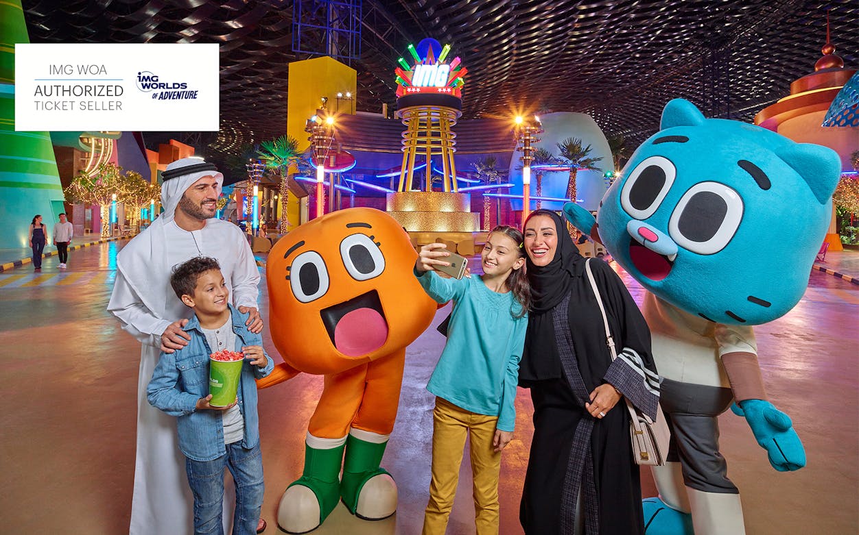Family taking a selfie with cartoon characters at IMG Worlds of Adventure, Dubai.