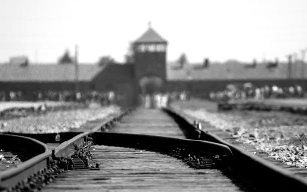 Rail tracks leading to Auschwitz Birkenau entrance, Krakow tour.