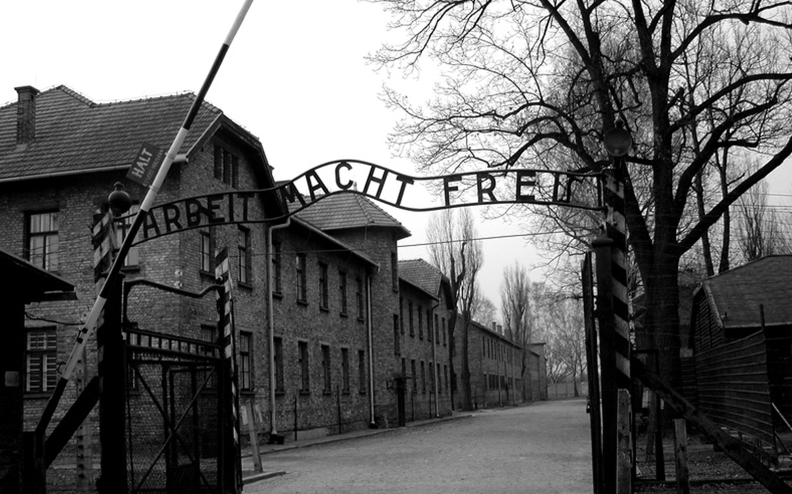 Entrance gate of Auschwitz Birkenau with "Arbeit Macht Frei" sign, part of guided tour from Krakow.