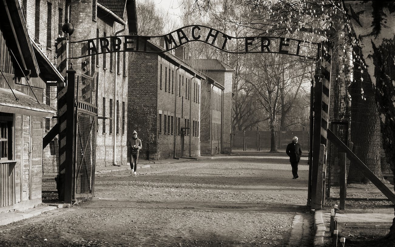 Entrance gate of Auschwitz Birkenau with "Arbeit Macht Frei" sign, part of Krakow tour.