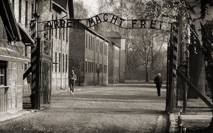 Entrance gate of Auschwitz Birkenau with "Arbeit Macht Frei" sign, part of Krakow tour.