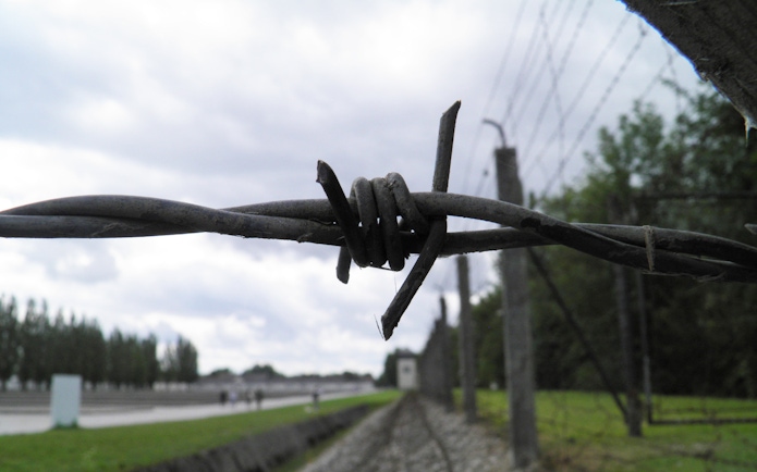 Barbed wire fence at Dachau Concentration Camp Memorial Site, Germany.
