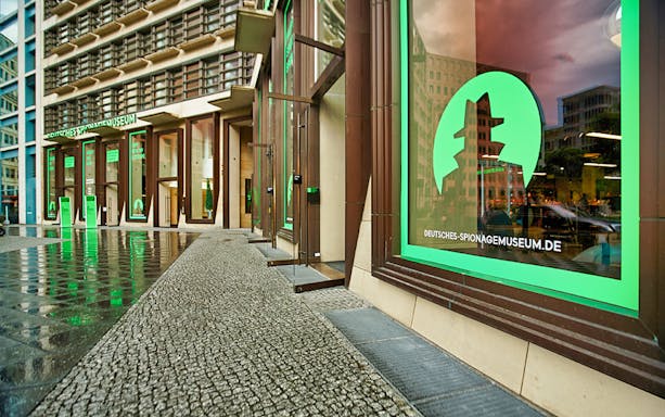 German Spy Museum entrance with green signage in Berlin.