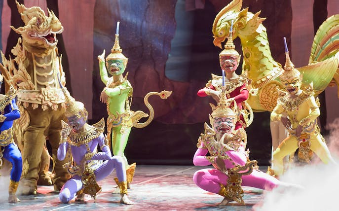Traditional Thai performers in colorful costumes at Siam Niramit Bangkok show.