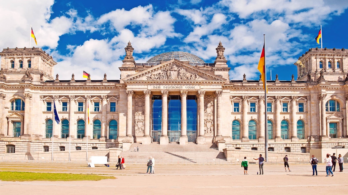Reichstag building in Berlin with visitors outside, part of a private guided tour.