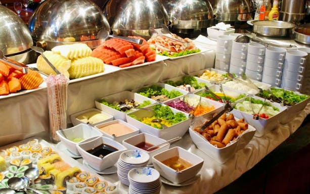 Buffet spread with fruits, salads, and sauces on Ayutthaya Day Tour with Grand Pearl River Cruise.