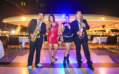 Musicians performing on a Chao Phraya dinner cruise in Bangkok.