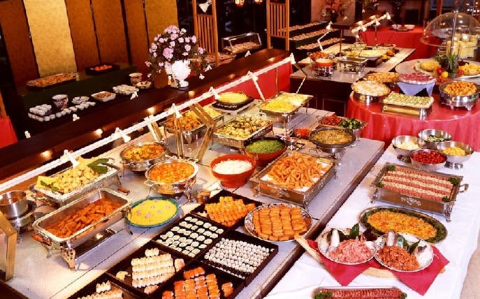 Buffet spread on the Grand Pearl Dinner Cruise with various international dishes.
