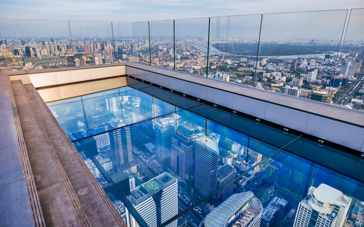 Mahanakhon SkyWalk glass floor with Bangkok city view.