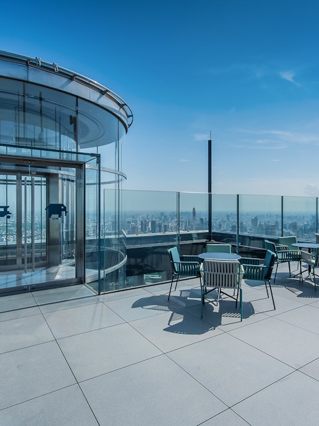 Mahanakhon SkyWalk outdoor terrace with city view and glass elevator in Bangkok.