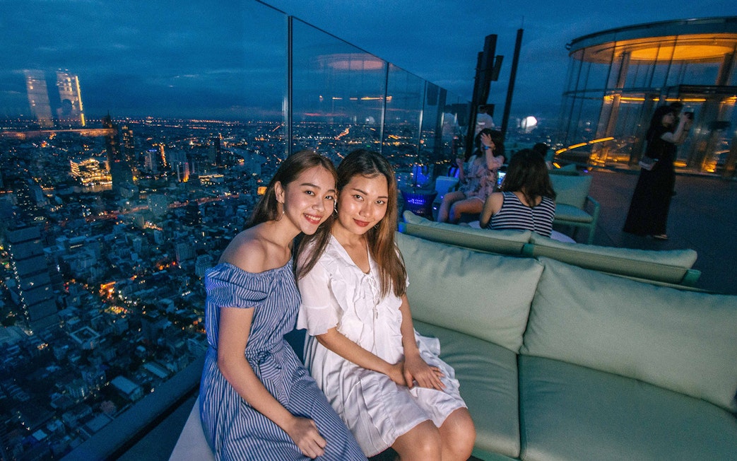 Guests enjoying the view at Mahanakhon SkyWalk, Bangkok.