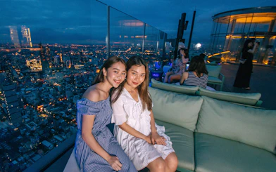 Guests enjoying the view at Mahanakhon SkyWalk, Bangkok.