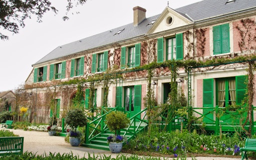 Giverny Monet's house with green shutters and garden, part of full day tour from Paris.