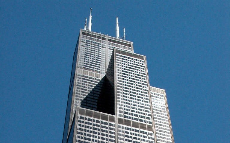 Willis Tower against clear blue sky in Chicago.