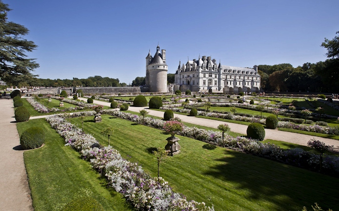 Chenonceau Castle with formal gardens in Loire Valley, France.