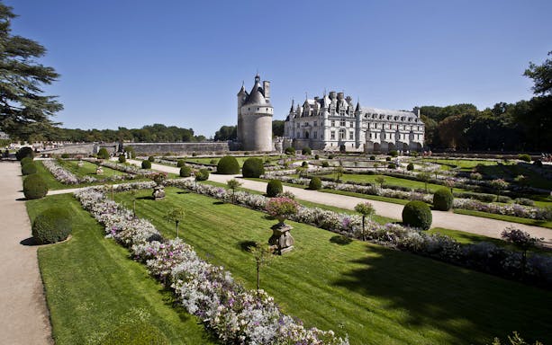 Chenonceau Castle with formal gardens in Loire Valley, France.