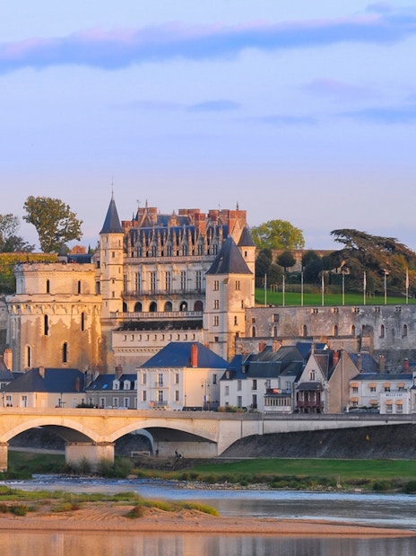 Amboise Castle with Loire River and bridge in foreground, France.