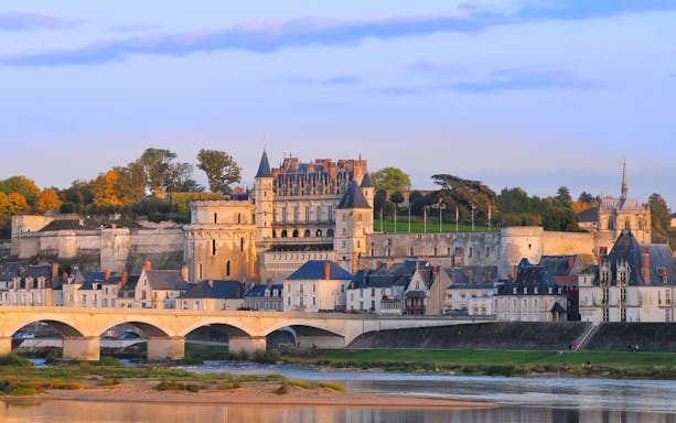 Amboise Castle with Loire River and bridge in foreground, France.