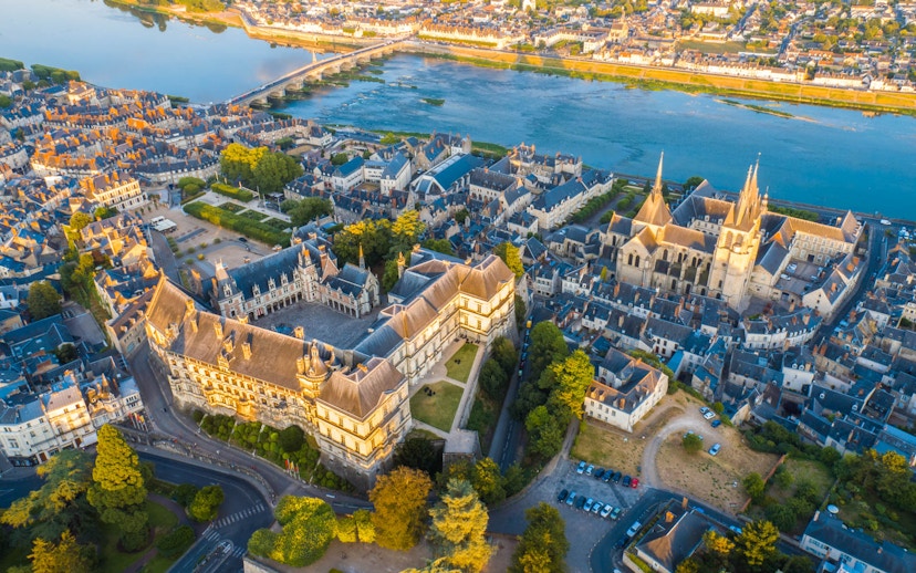 Aerial view of Blois cityscape and Loire River in France, highlighting historic architecture.