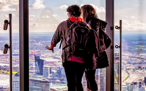 Visitors enjoying city views from Melbourne Skydeck at Eureka Tower.