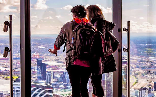 Visitors enjoying city views from Melbourne Skydeck at Eureka Tower.