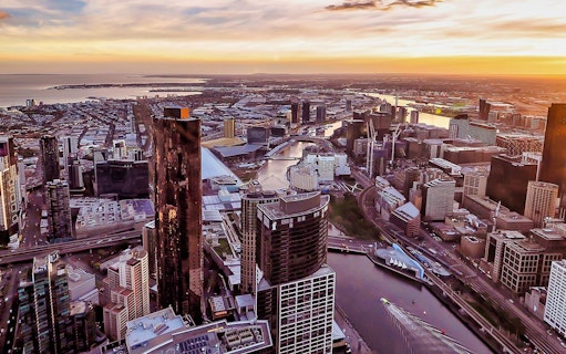 Aerial view of Melbourne cityscape at sunset from Eureka Tower Skydeck.