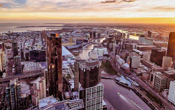 Aerial view of Melbourne cityscape at sunset from Eureka Tower Skydeck.