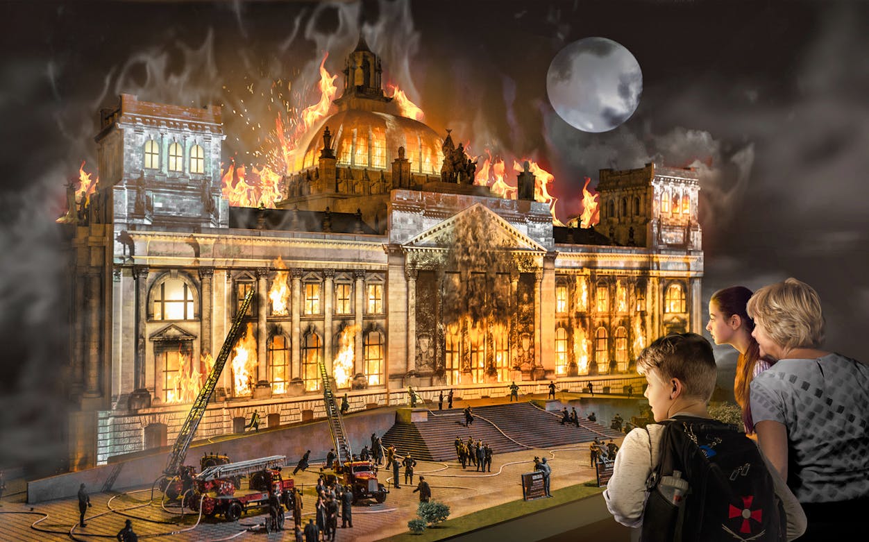 Miniature model of a historic building on fire at Little BIG City, Berlin.